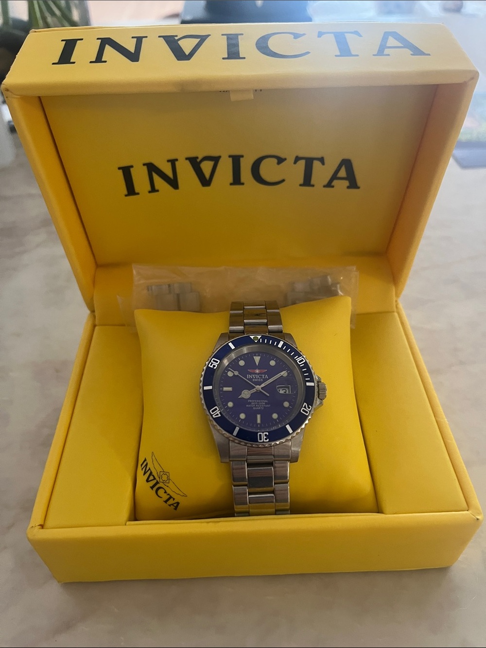 Invicta Silver Stainless Steel Watch with Blue Dial and Bezel
